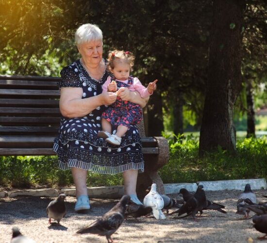 grandmother-granddaughter-walk-park_105818-1065